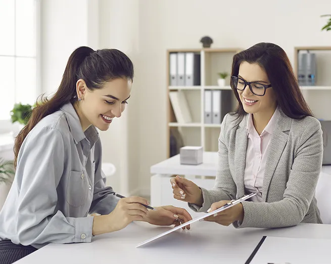An agent talking to a young couple